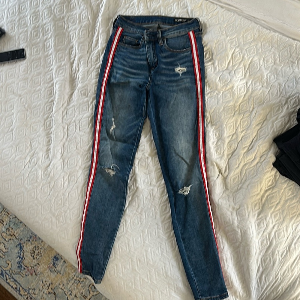 Blank NYC lightly distressed skinny jeans with red stripes